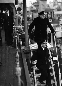 British Prime Minister Winston Churchill leaves a destroyer depot during his visit to