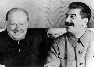British Prime Minister Winston Churchill shares a joke with Soviet leader Josef Stalin