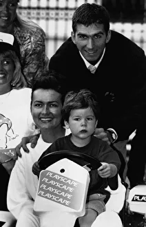 British racing driver Damon Hill and his wife Georgie try out their son Joshua behind