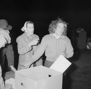 Partnership Prints: British racing drivers Pat Moss and Ann Wisdom check in looking tired after finishing