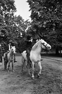 British rock group The Kinks pose on horses in the gardens opposite the Flaghouse in