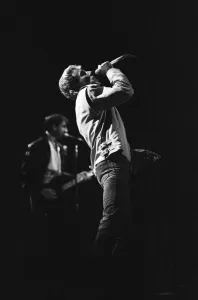 British rock group The Who, performing on stage at the NEC in Birmingham. Roger Daltrey