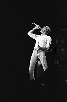 British rock group The Who, performing on stage at the NEC in Birmingham. Roger Daltrey