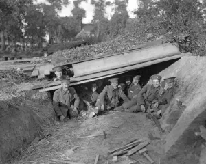 00117 Prints: British Royal Marines seen here enjoying a rest and a smoke in their bomb-proof shelter