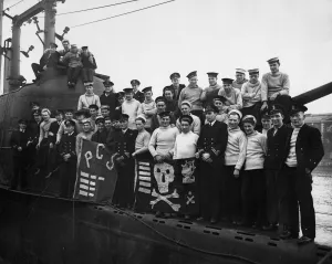 Crew Prints: British Royal Navy submarine HMS Porpoise returns to its base in Portsmouth