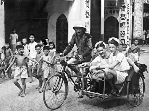 British sailors of the Royal Navy on shore leave in Singapore are transported by an