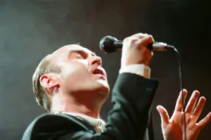 British singer Phil Collins performing on stage during a concert in Britain