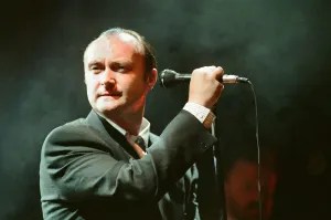 British singer Phil Collins performing on stage during a concert in Britain