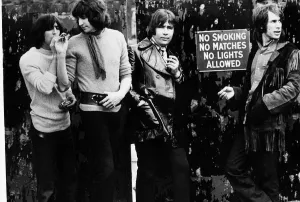 British Sixties pop group The Troggs smoking next to no smoking sign