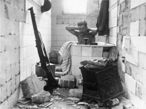 A British solder having a bath. Tobruk. Libya. The Siege of Tobruk lasted