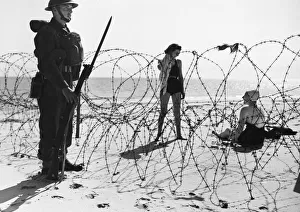 Wire Prints: British soldiers guard a beach in England during the Second World War