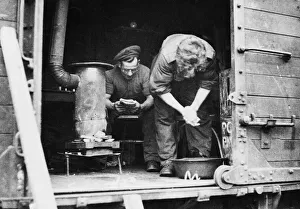 Wagon Prints: British soldiers in their makeshift home; Sapper Remington spends his spare time in a