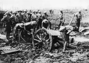 00152 Prints: British soldiers man handle a gun bogged down in mud on the Western Front during