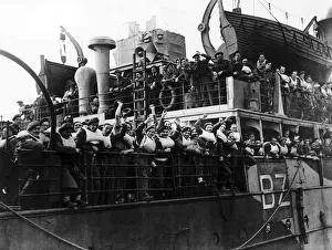 British soldiers wave from troop ship returning to England from Calais after a long spell