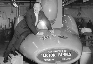 00324 Prints: British speed record breaker Donald Campbell at Motor Panels, Holbrooks