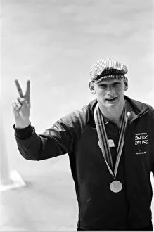 Images Dated 22nd July 1980: British swimmer Duncan Goodhew celebrates after receiving olympic gold medal in