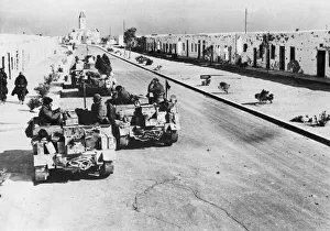 British tanks make their way through a town in Algeria during the Second World War