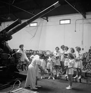 British tennis star Fred Perry demonstrates to members of the Yarrow Youth Club in