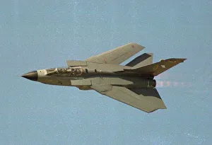 Air Shows Prints: A British Tornado GR1 fighter flies at speed with wings swept back at the Farnborough Air