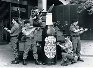 00135 Prints: British troops guarding a 6 foot tall bottle of Newcastle brown ale standing in front of