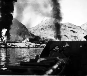 Explosions Prints: British troops landing under fire at Vaagso & Maaloy Isles Norway. December 1941