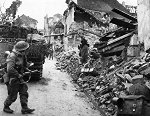 Bombed Prints: British troops occupying Kleve eliminating snipers. Circa February 1945