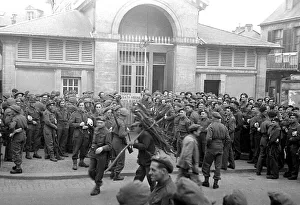 00189 Prints: British troops outside the bath house in a Normandy town in Northern France shor
