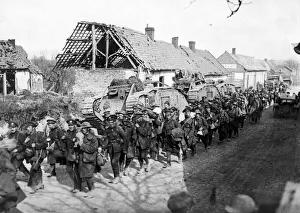 00433 Prints: British troops passing tanks in a French village close to Amiens following the German