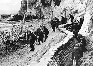 00154 Prints: British troops patrol beaches as part of the British coastal defences during WW2 1941