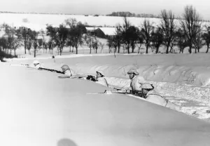 Exercise Prints: British troops in winter camouflage take part in an exercise during the Second World War