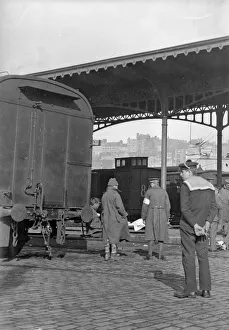 Casualty Prints: British wounded soldiers seen here at the cross channel railway station in Boulogne await