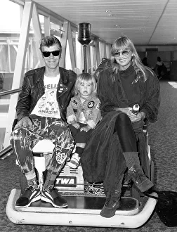 Britt Ekland actress and her husband Jim McDonnell with her son Thomas arriving