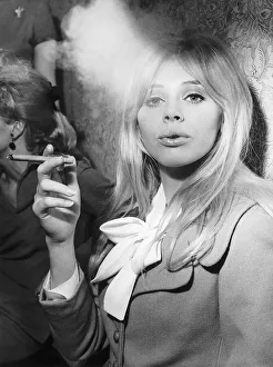 Britt Ekland Actress pictured enjoying the cigar at the Ideal Home Exhibition in London