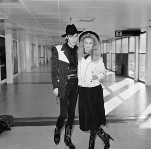 Britt Ekland with boyfriend Slim Jim McDonnell at Heathrow Airport. 16th November 1982