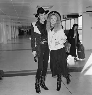 Britt Ekland with boyfriend Slim Jim McDonnell at Heathrow Airport. 16th November 1982