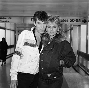 00840 Prints: Britt Ekland with boyfriend Slim Jim McDonnell at Heathrow Airport after flying in