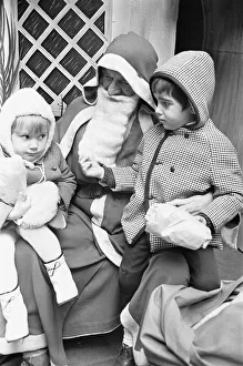 Suspicious Prints: As her brother checks out Santa Clauss beard in Wellsteed department store in Broad
