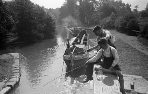 Brothers fishing from the Grand Union Canal lock gates between Watford and Rickmansworth