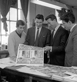 Bill Brown of Tottenham Hotspurs who runs a print company shows West Ham players Ron