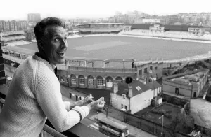Bruce Forsyth Entertainer July 1965 looking over the balcony of his flat which