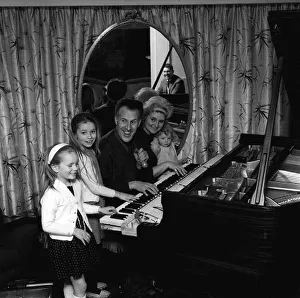 Bruce Forsyth with Family 1964 Comedian with wife and children playing at piano