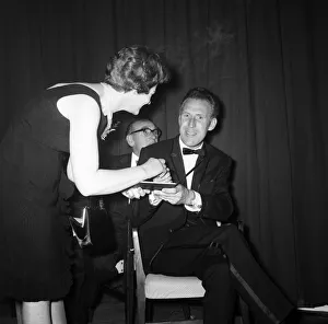 00817 Prints: Bruce Forsyth signing an autograph at the Daily Mirror Television Award show