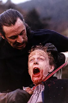 The Bruce Gladiator Wolf cutting mans throat with sword scene from film The Bruce
