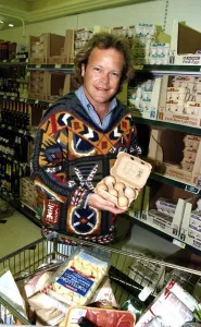 Bruno Brookes Disc jockey and TV Presenter holding open a carton of eggs while doing