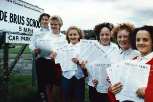 De Brus School pupils with their community newsletter - left to right, Louise Calvert