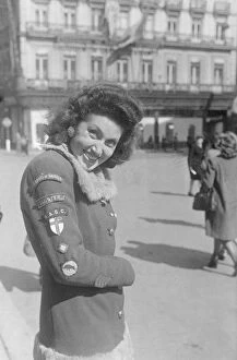 Badges Collection: A Brussels girl whose hobby is collecting badges from the liberating Allied troops