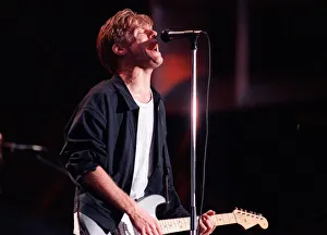 Bryan Adams pop singer Parkhead concert singing on stage microphone guitar Celtic Park