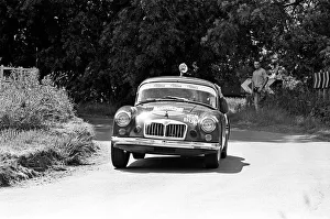 Automobile Prints: Bryan Halladay from Warwick in a bright red 1962 MGA which he will be driving in