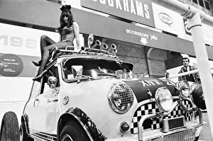 Horns Prints: Bunny girl drapped over mini car at Motor Show at Horticultural Hall 2nd January 1968