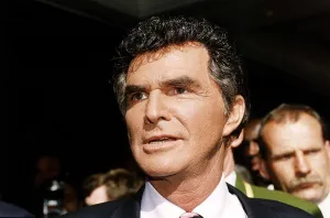 Burt Reynolds American Actor opens the Harrods sale - without his famous